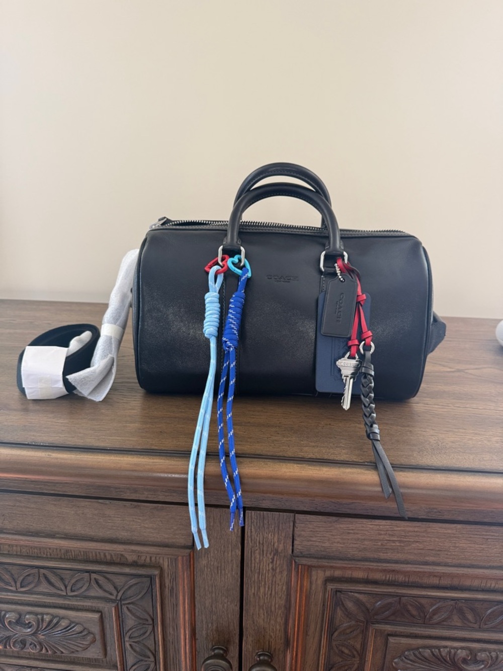 Coach Black Leather Duffel with Blue and Red Cord Tassels